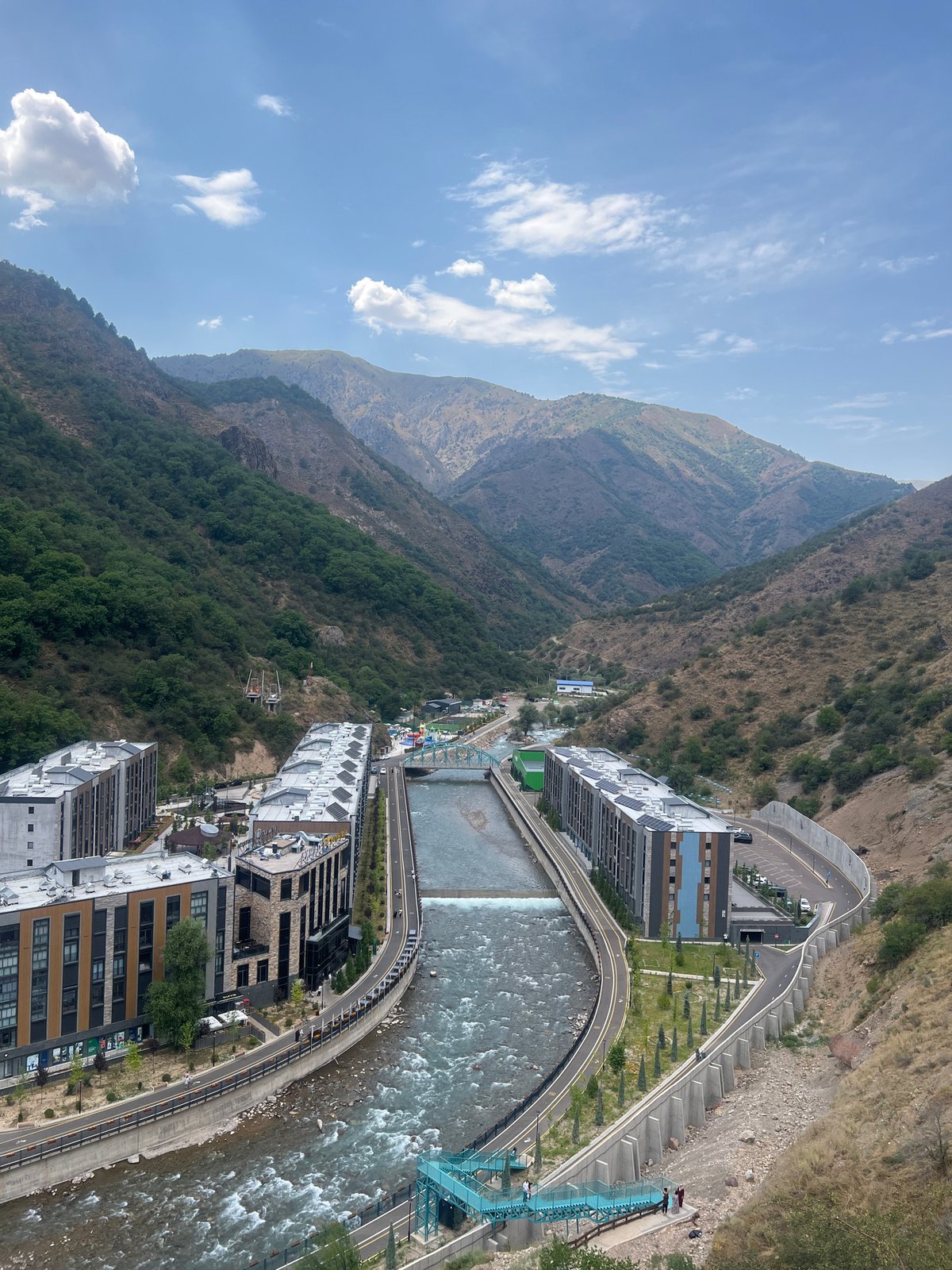 Khumsan valley views: riverside city, lookout platform, and mountain bridge