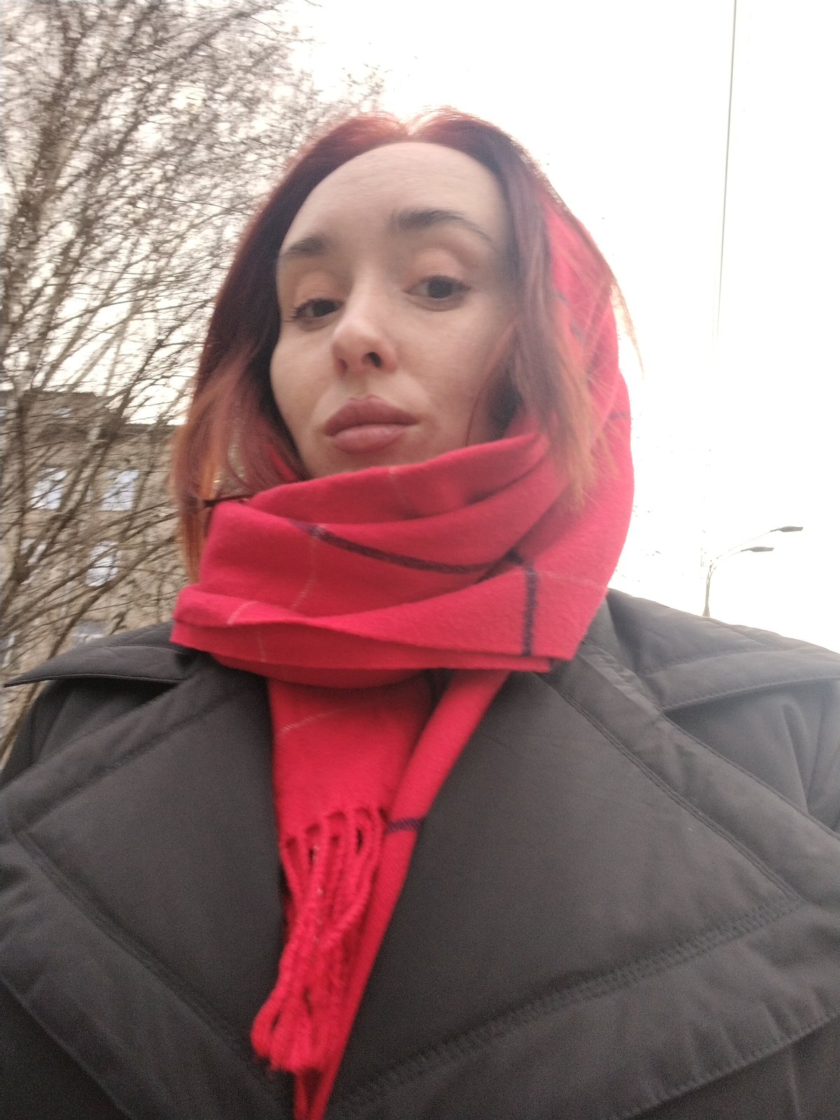 Woman in red plaid scarf observed in Izhevsk