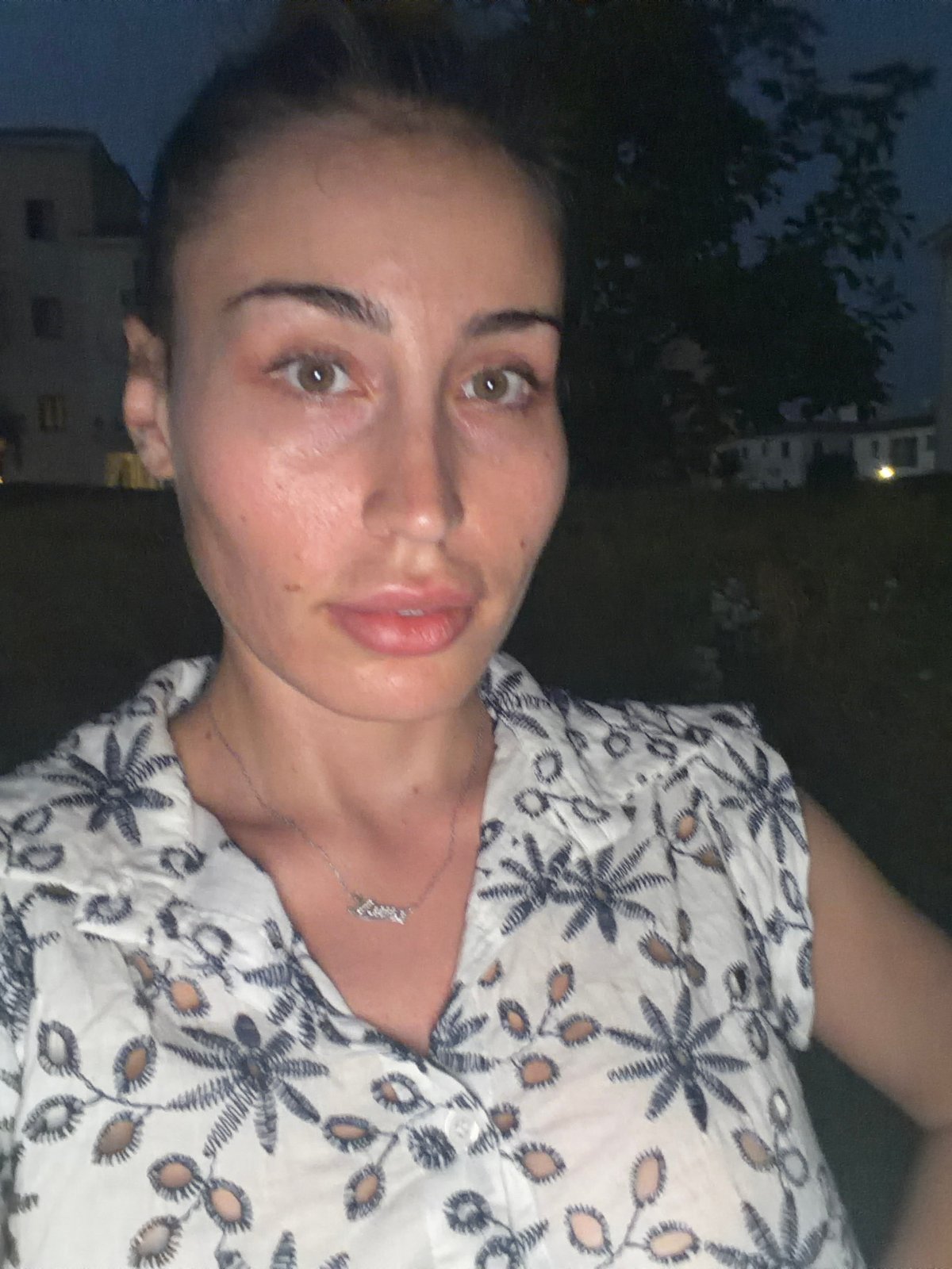 Woman documents evening stroll through Tersefanou, Cyprus at twilight