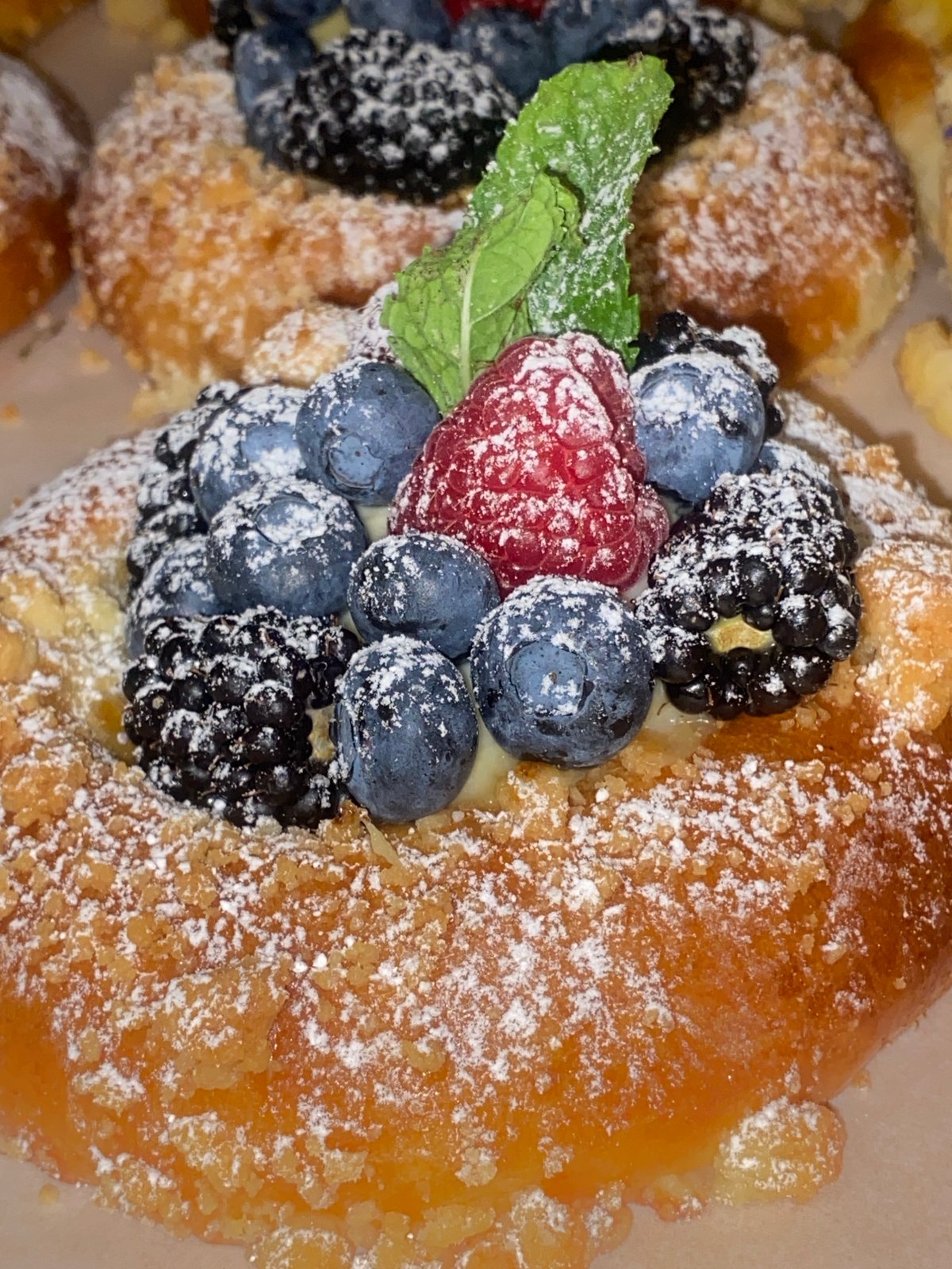 Warsaw café pastries and elaborate mythological murals, midday