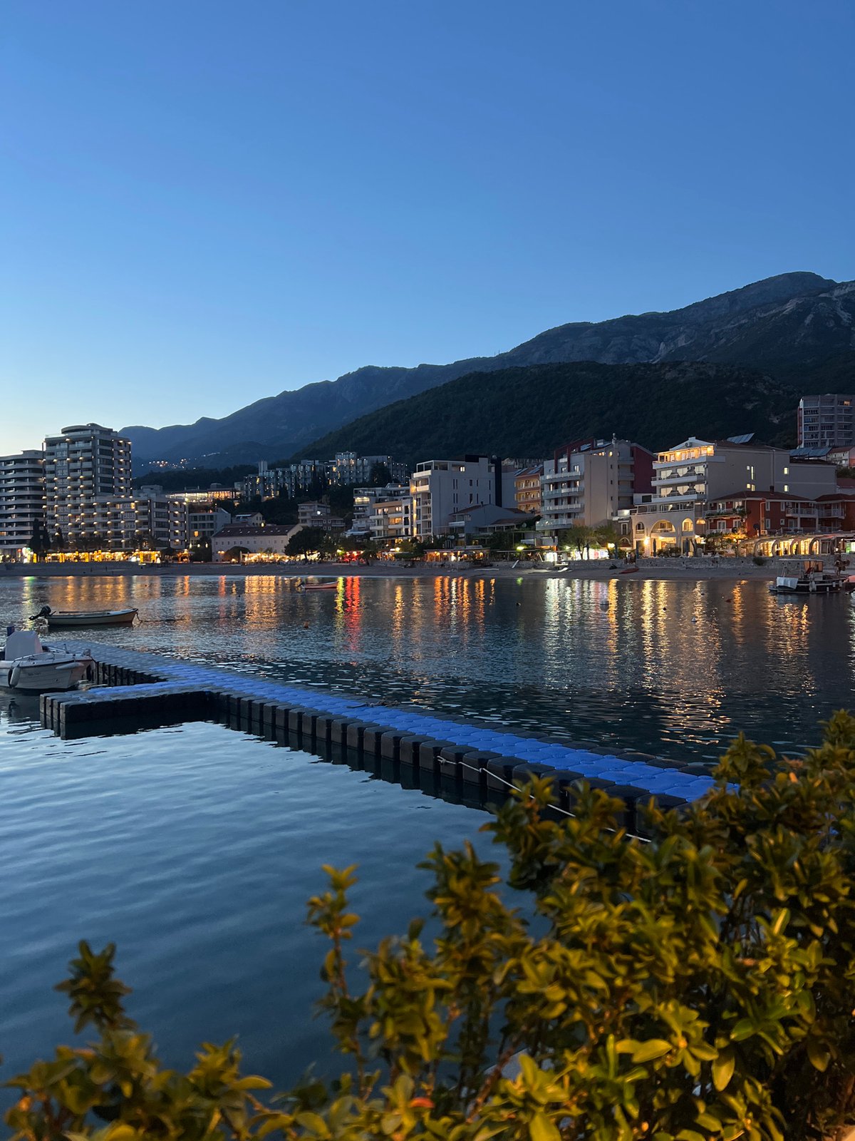 Evening khachapuri dinner shared at Montenegro waterfront during dusk