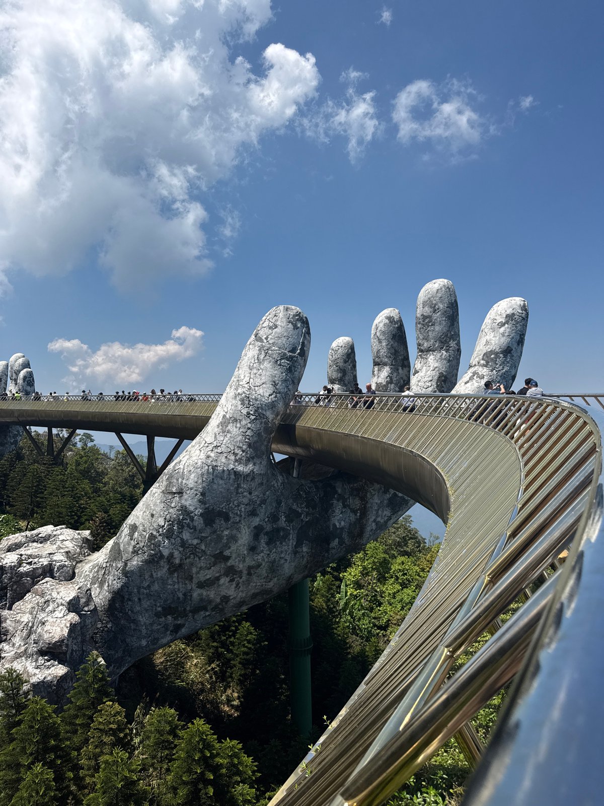 Tourists photograph iconic Golden Bridge at Vietnam's Bà Nà Hills