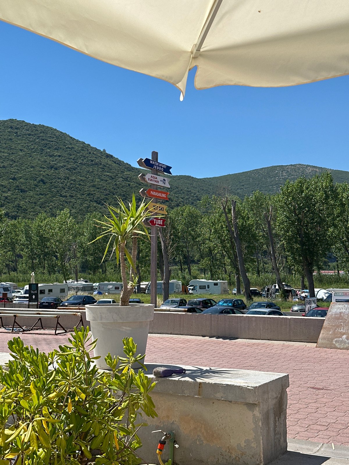 Busy summer afternoon on a Montenegrin Adriatic pebble beach