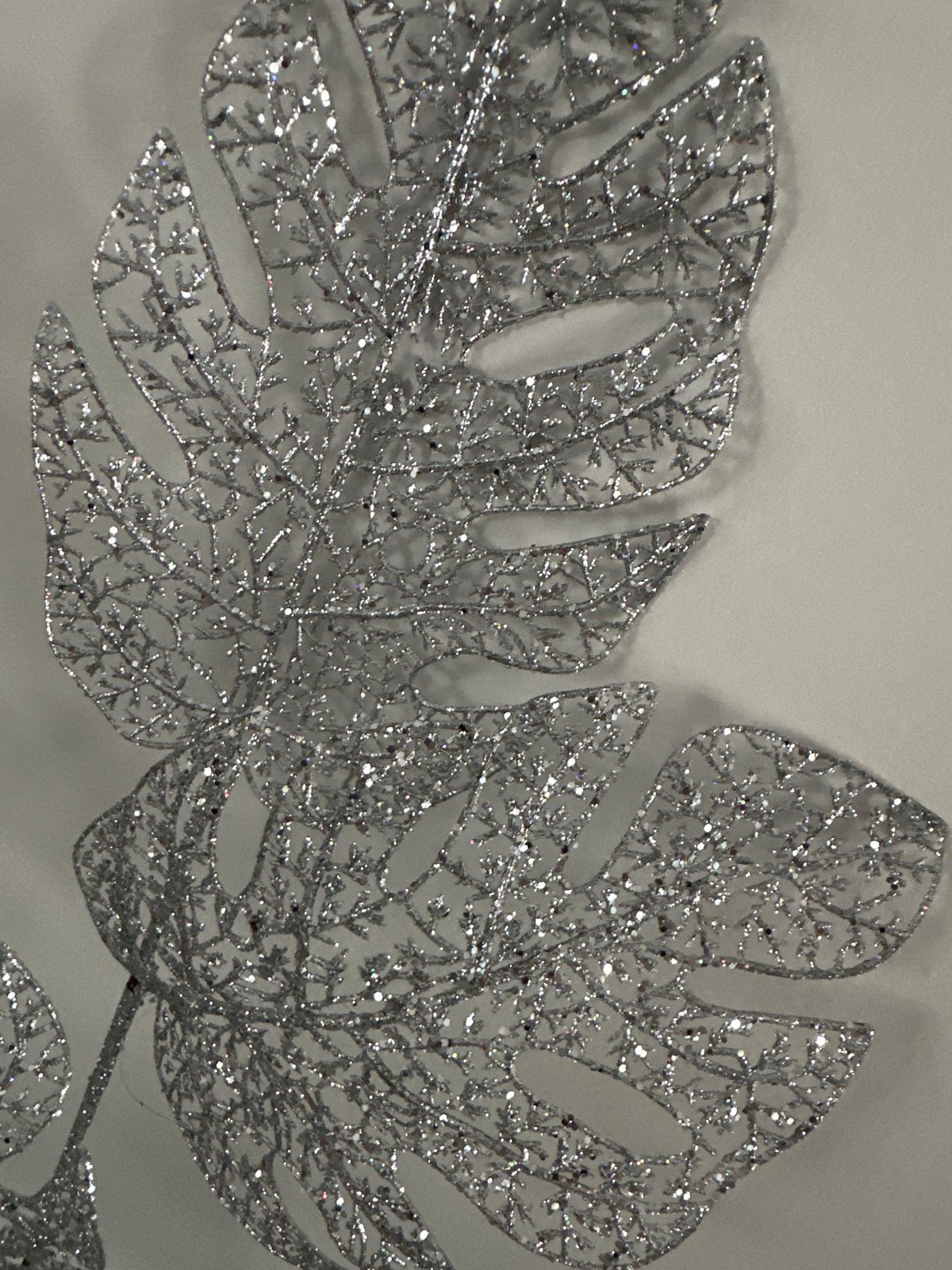 Floral arrangements and glittery decorative details up close
