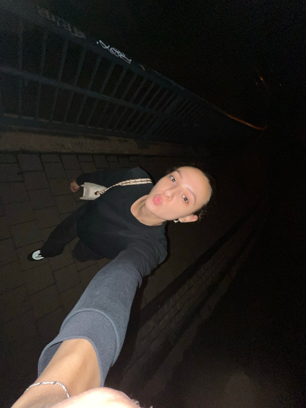 Woman documents nighttime walk through Saarbrücken in selfie series