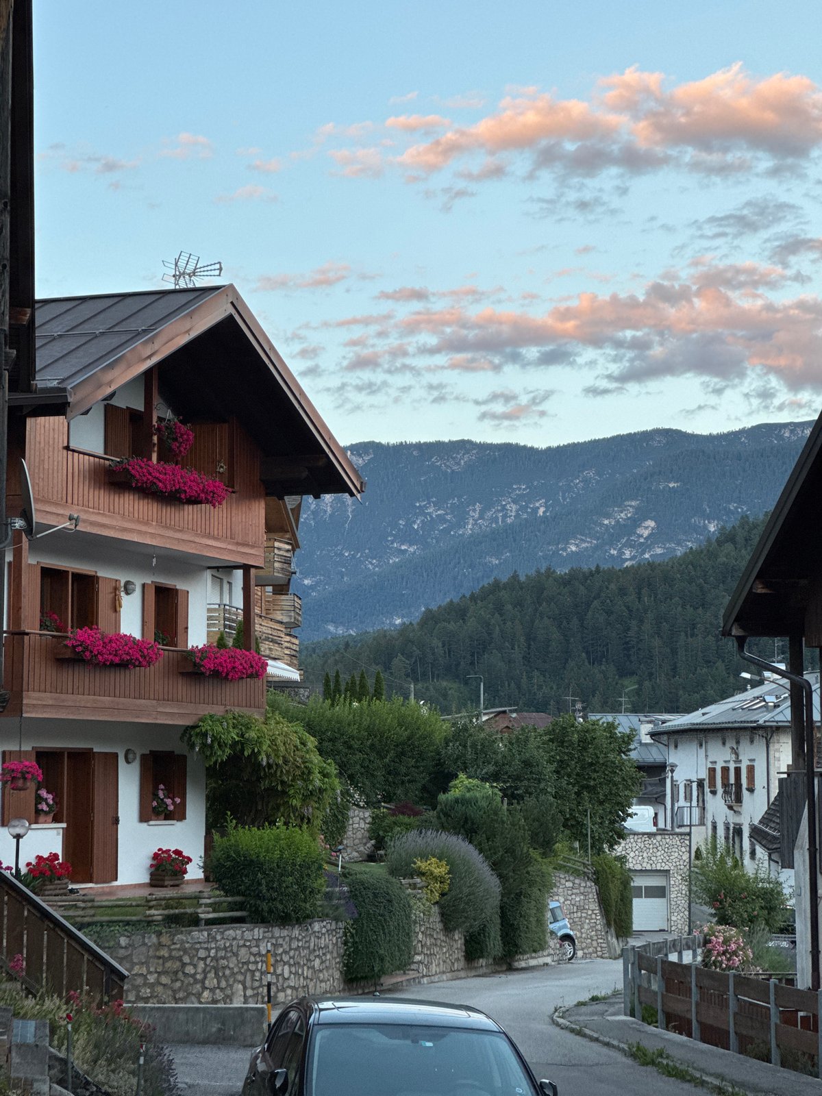 Alpine village and mountain peaks at golden hour, Valle di Cadore