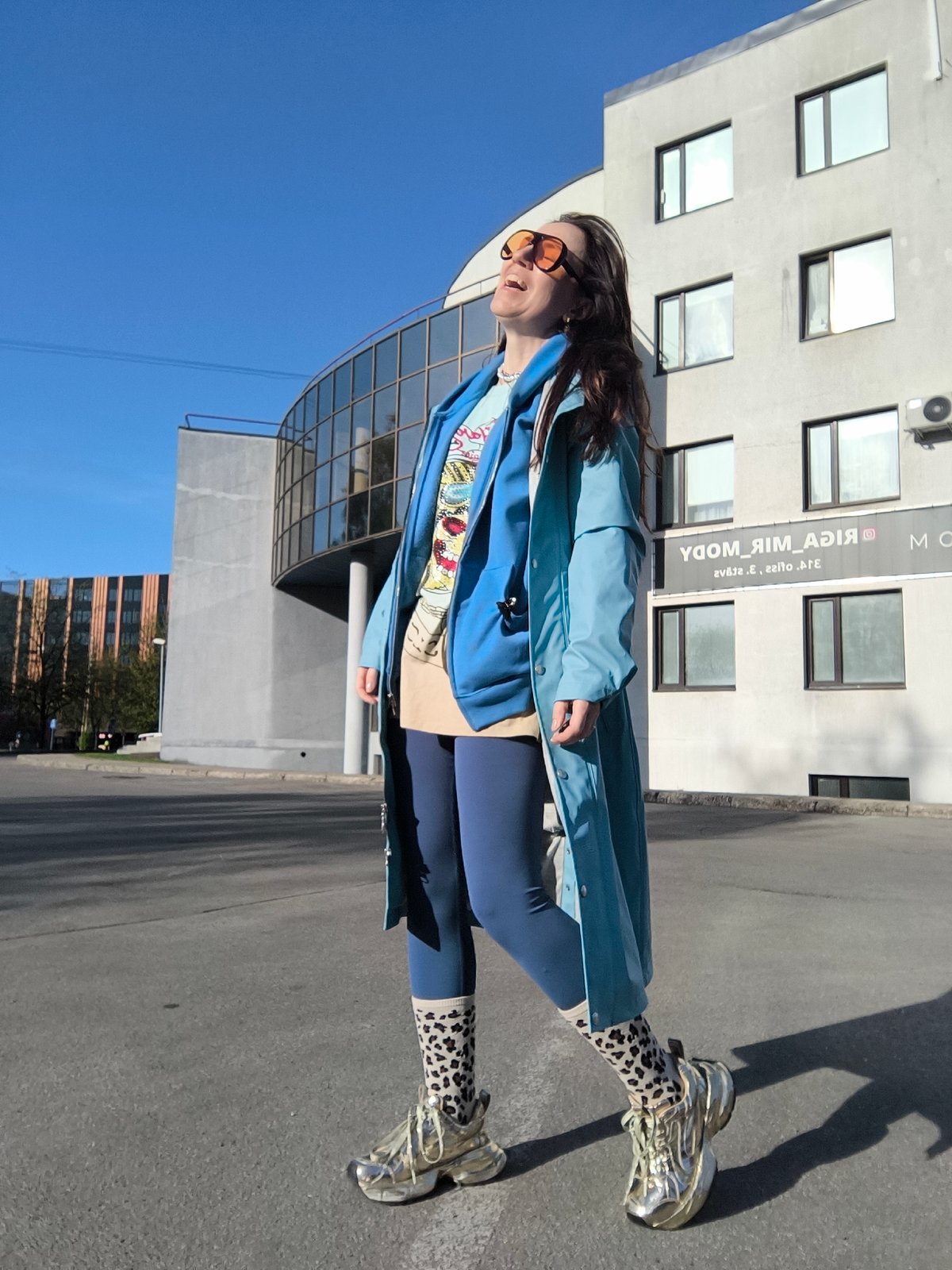 Woman in orange sunglasses spotted walking in Riga
