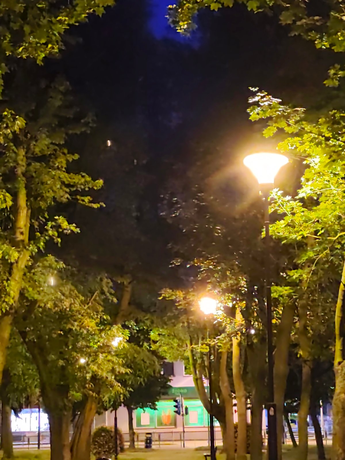 Stryków streets and parks settle into a summer evening