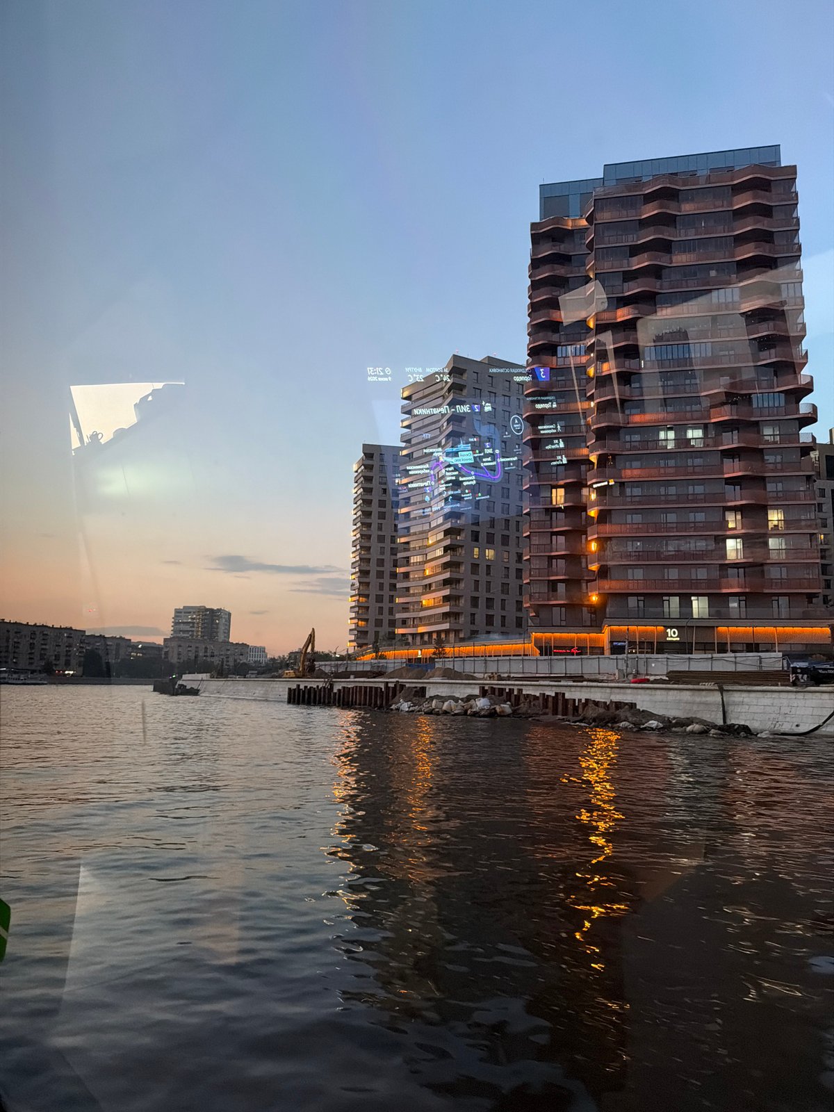 Evening boat cruise captures Moscow skyline at sunset
