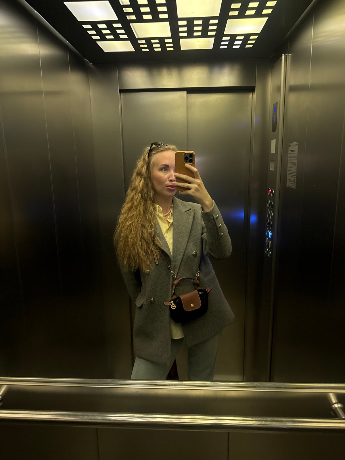 Person takes selfie in elevator in Sirius, Russia