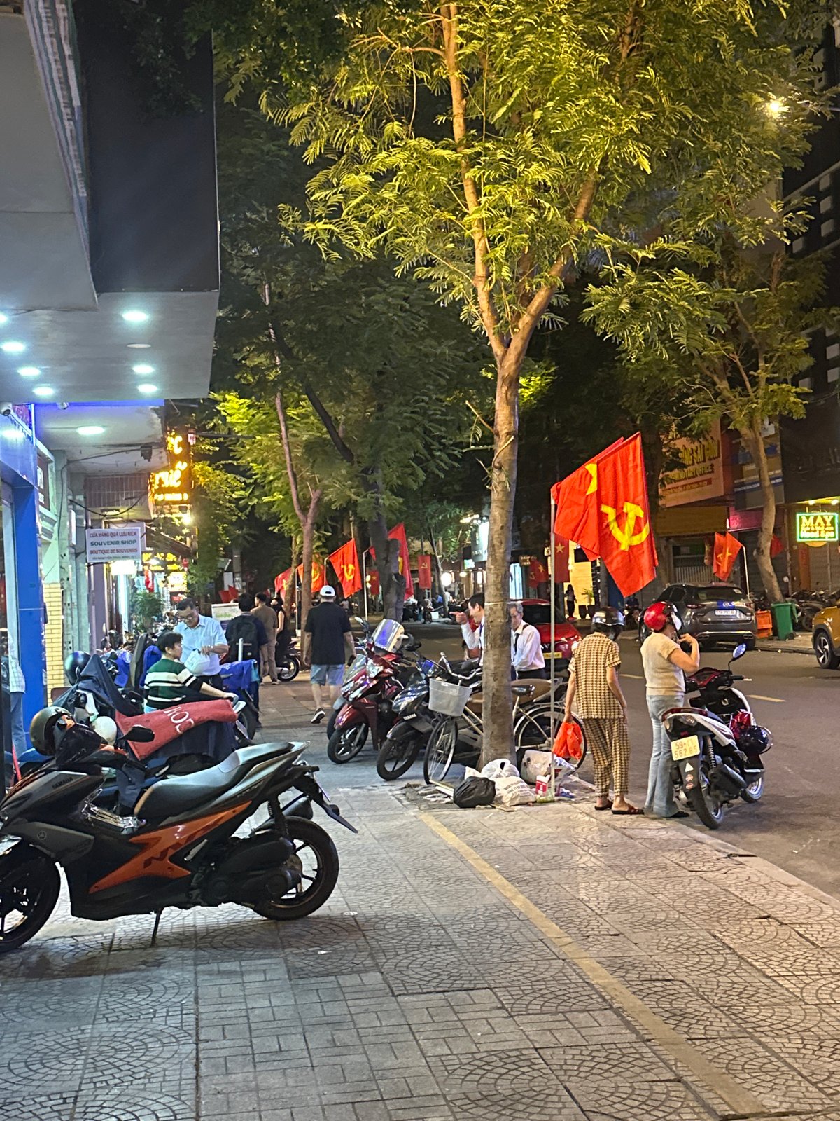Thủ Đức nightlife: busy streets, neon signs, and motorbike traffic