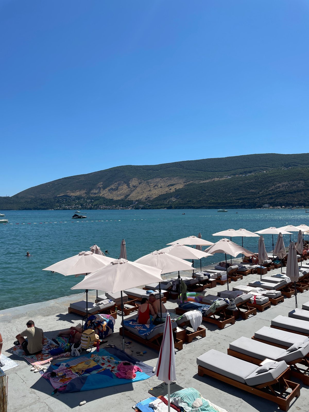 Busy summer afternoon on Igalo's waterfront pier