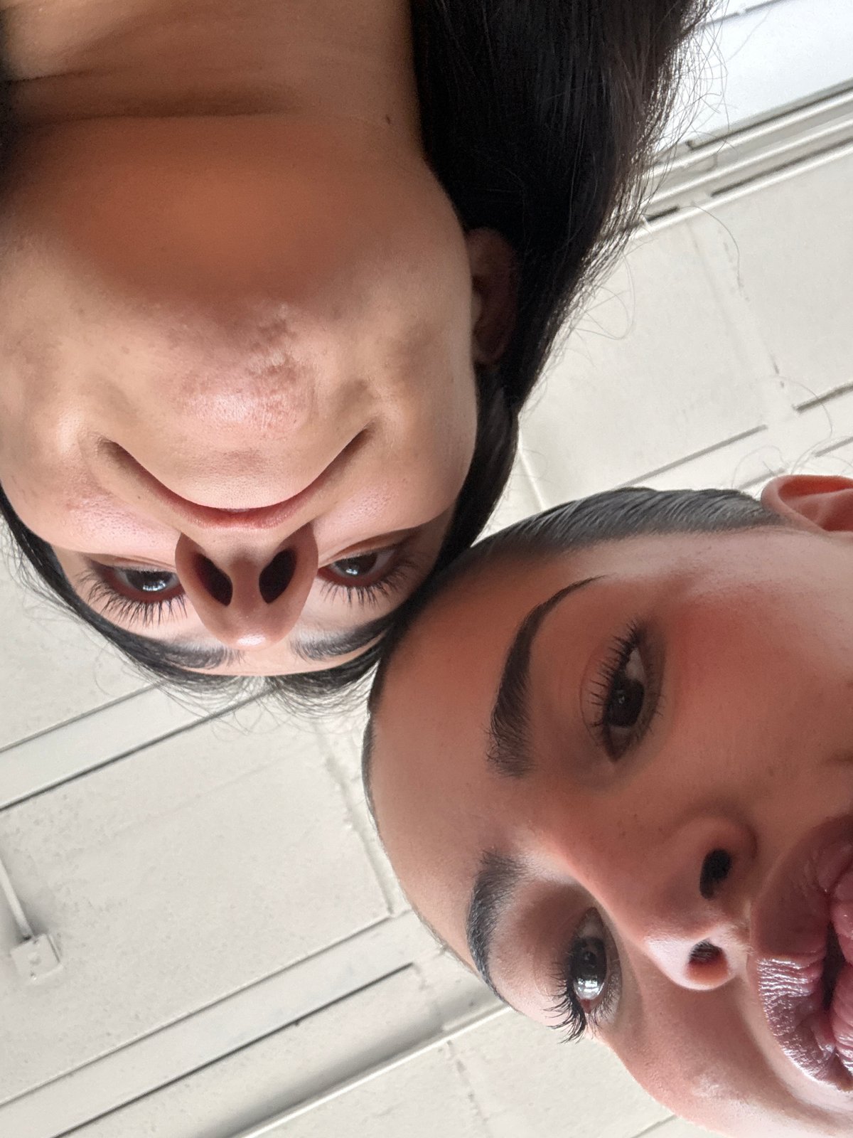 Two women photographed from below in Puebla, Mexico