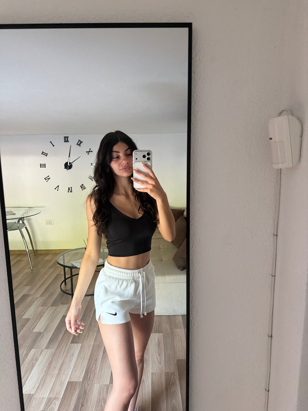 Woman takes multiple mirror selfies in Gabrovo, Bulgaria