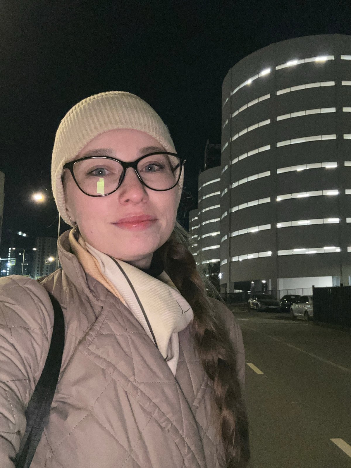 Woman documented during evening stroll through Saint Petersburg streets