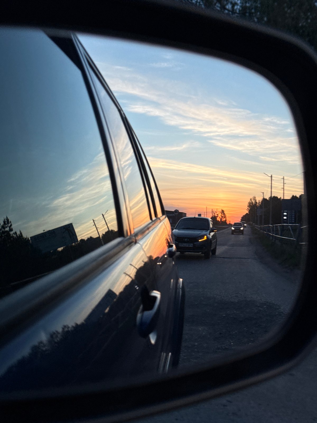 Woman drives through Chaikovsky taking selfies during evening commute