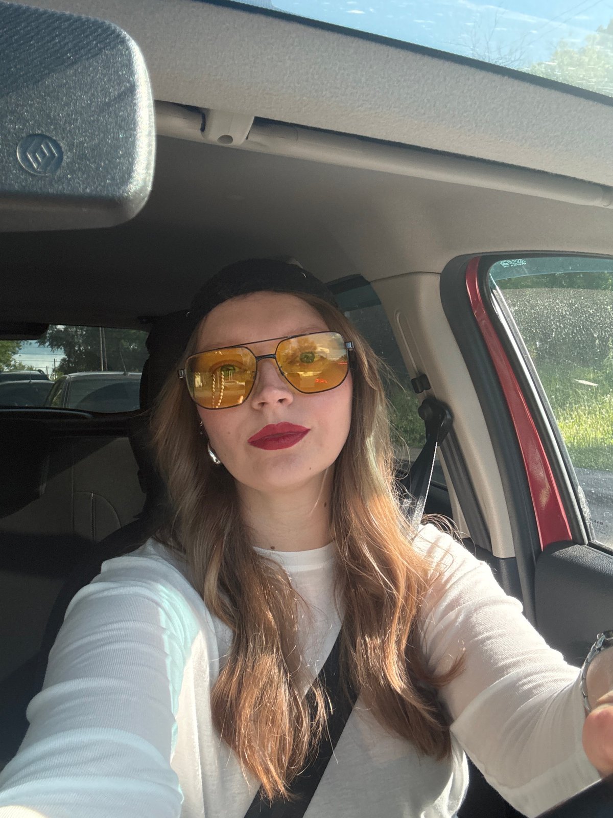 Driver takes selfie in sunlit car in Izhevsk