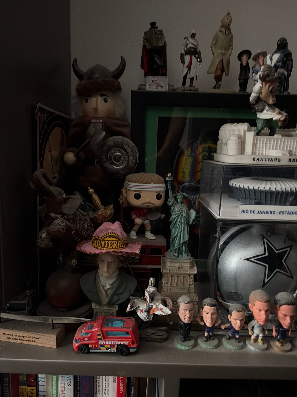 Personal collectibles shelf documented in Mexico City home