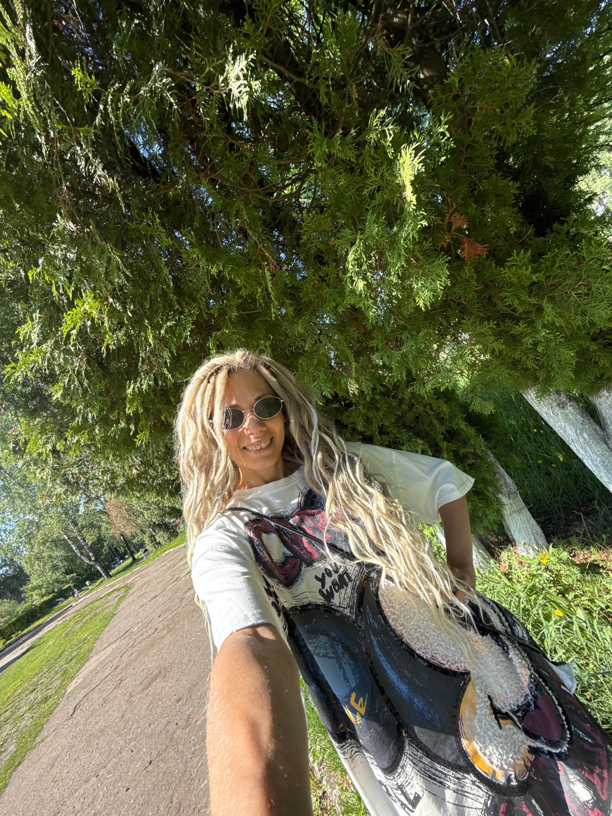 Woman photographed smiling in park in Шебунино, Russia