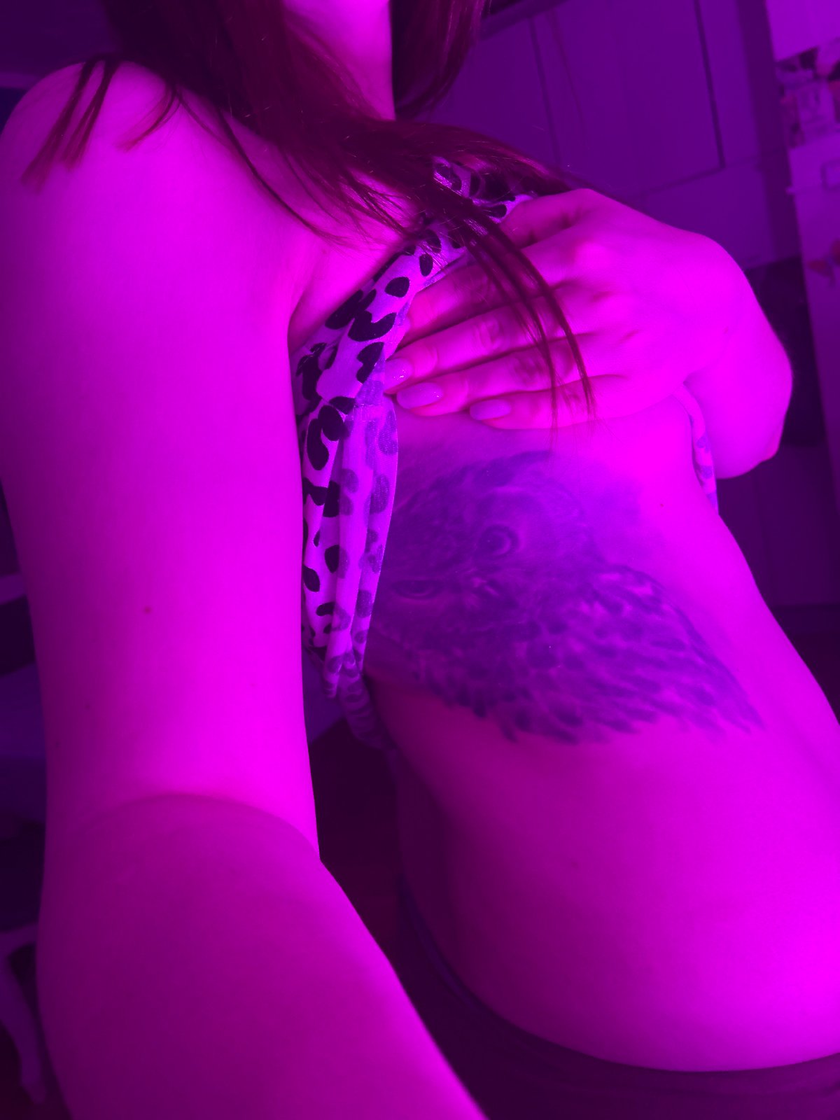 Woman photographed in leopard print with tattoos in Russia