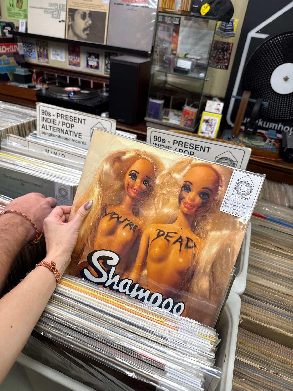 Customer browses vinyl records at Bangkok music store