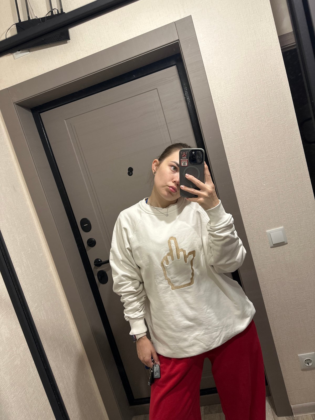 Woman takes mirror selfie in Perm apartment