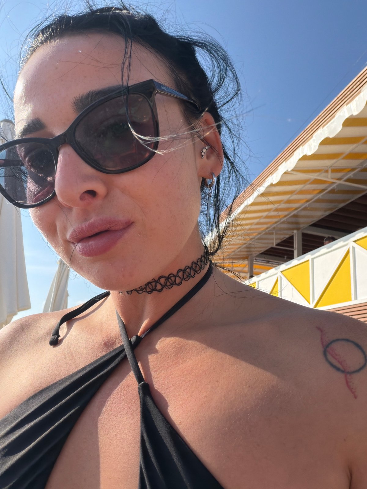 Woman takes selfie in black bikini in Shepsi, Russia