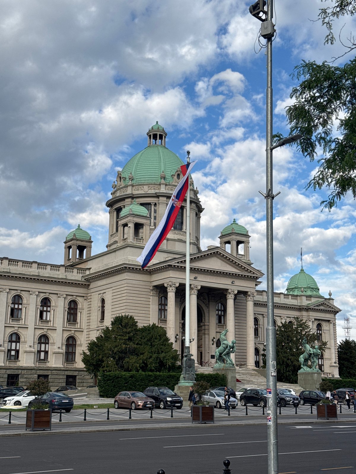 Tourist documents afternoon stroll through central Belgrade with drinks