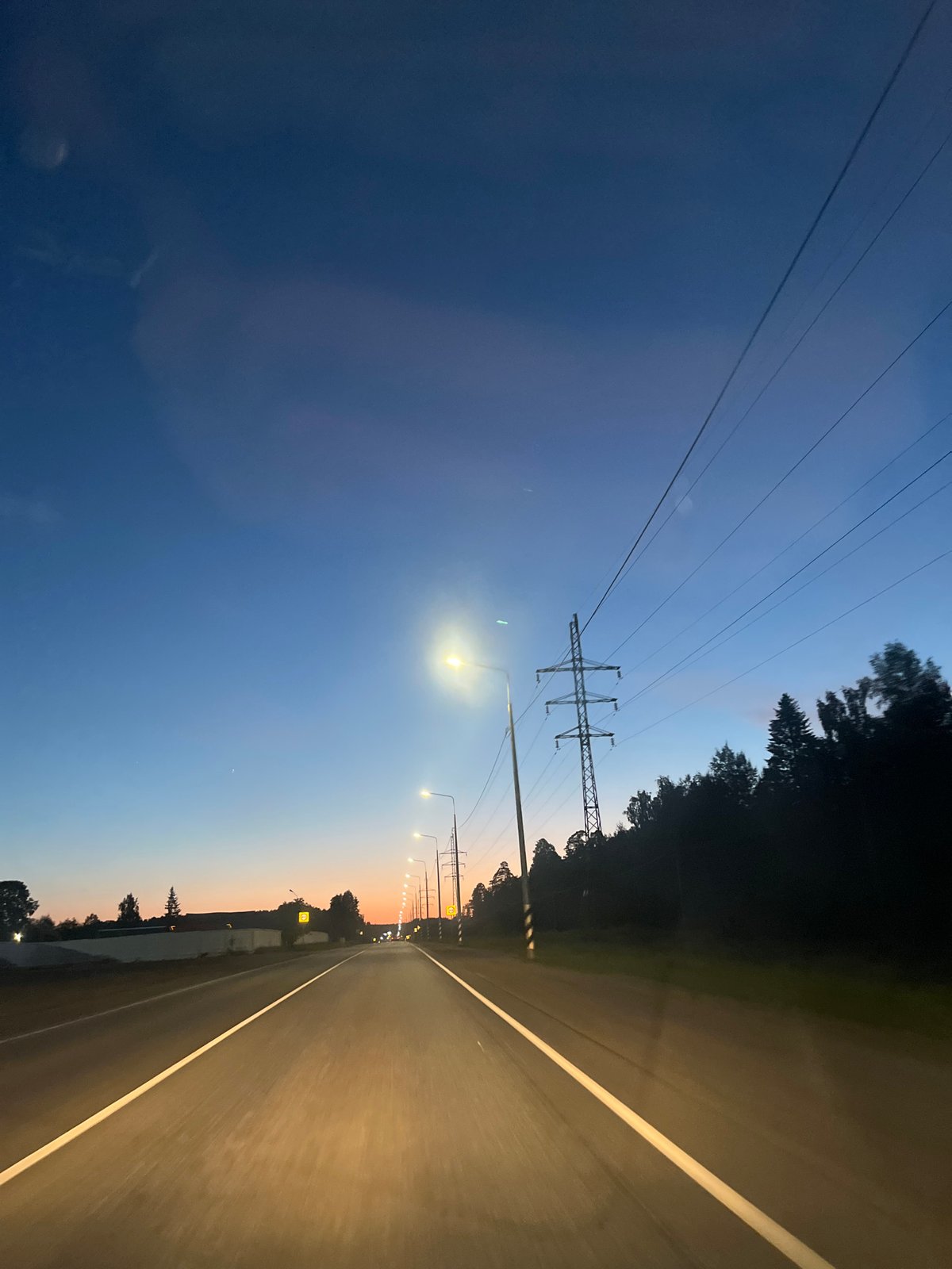 Twilight highway scene captured in Chaikovsky, Russia