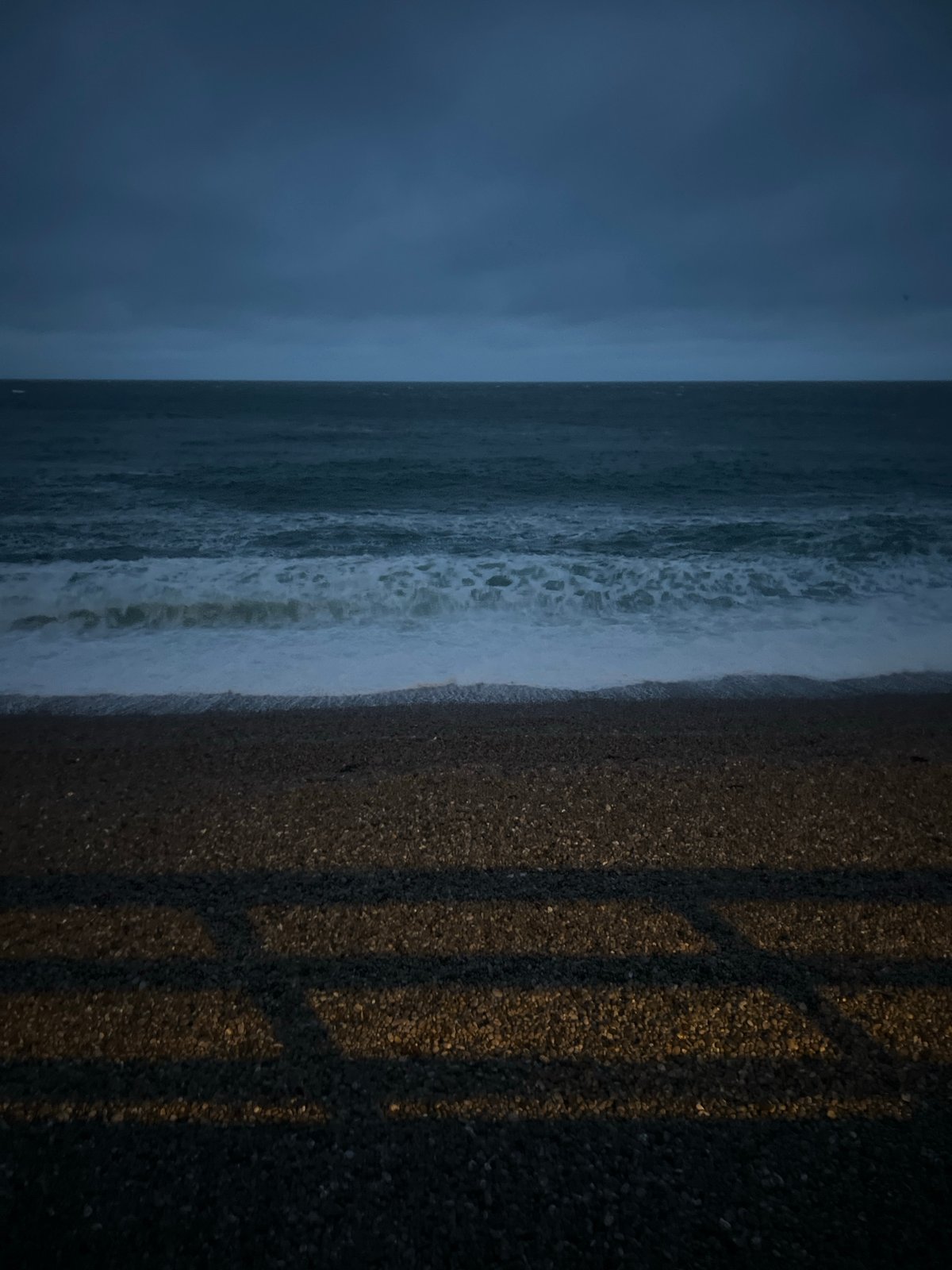 Twilight scenes captured along Étretat coastline during evening hours