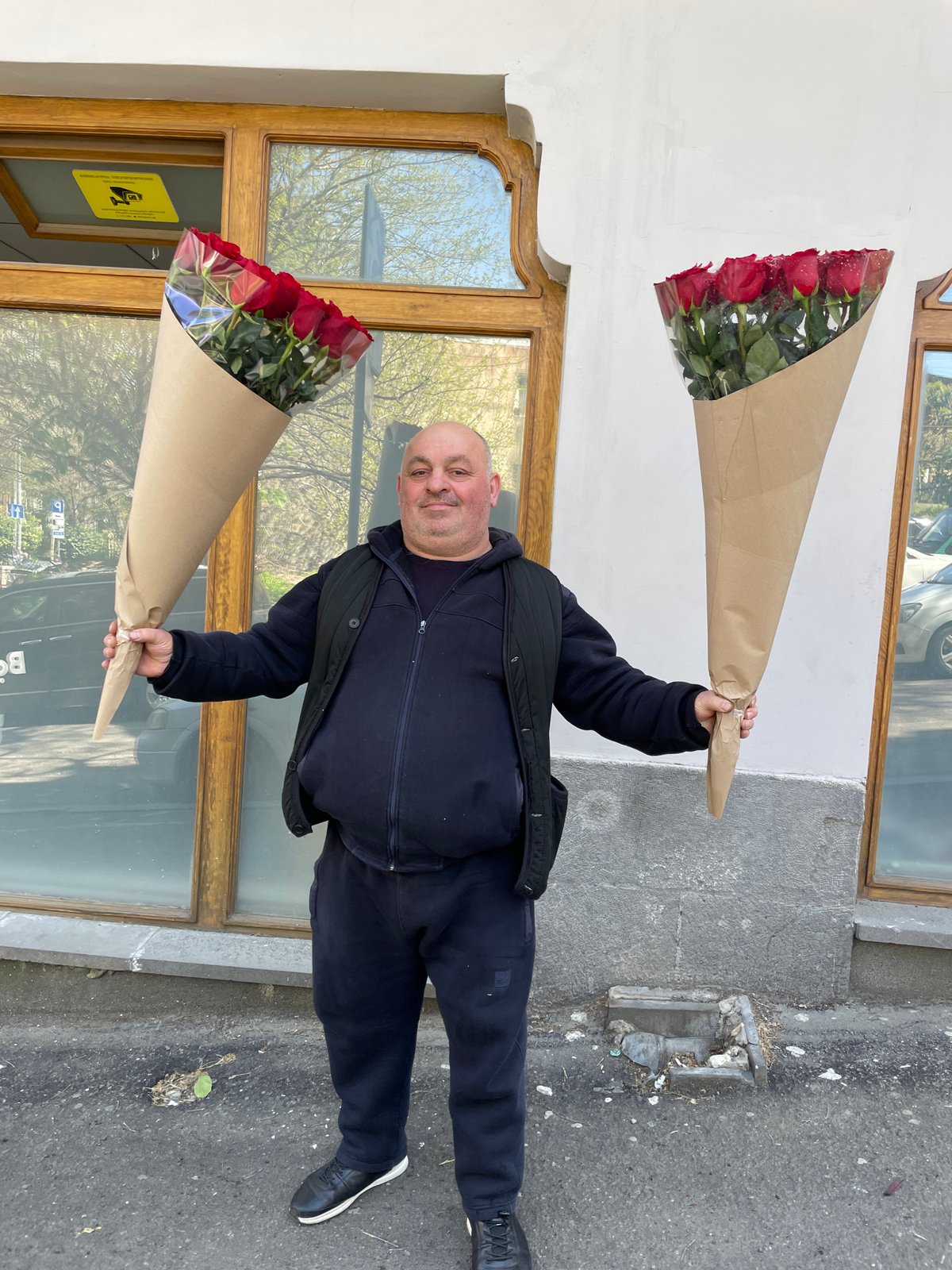 Man with roses, tea service observed in Tbilisi