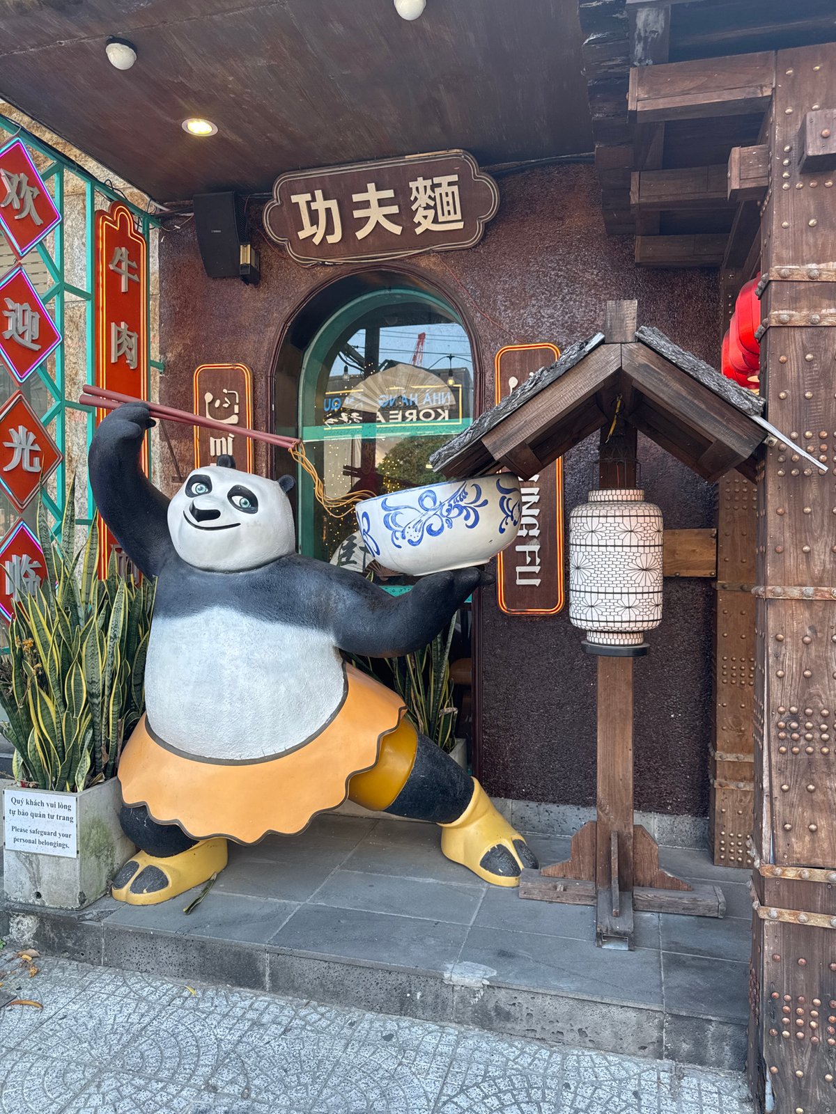 Panda statue with chopsticks spotted outside Đà Nẵng restaurant