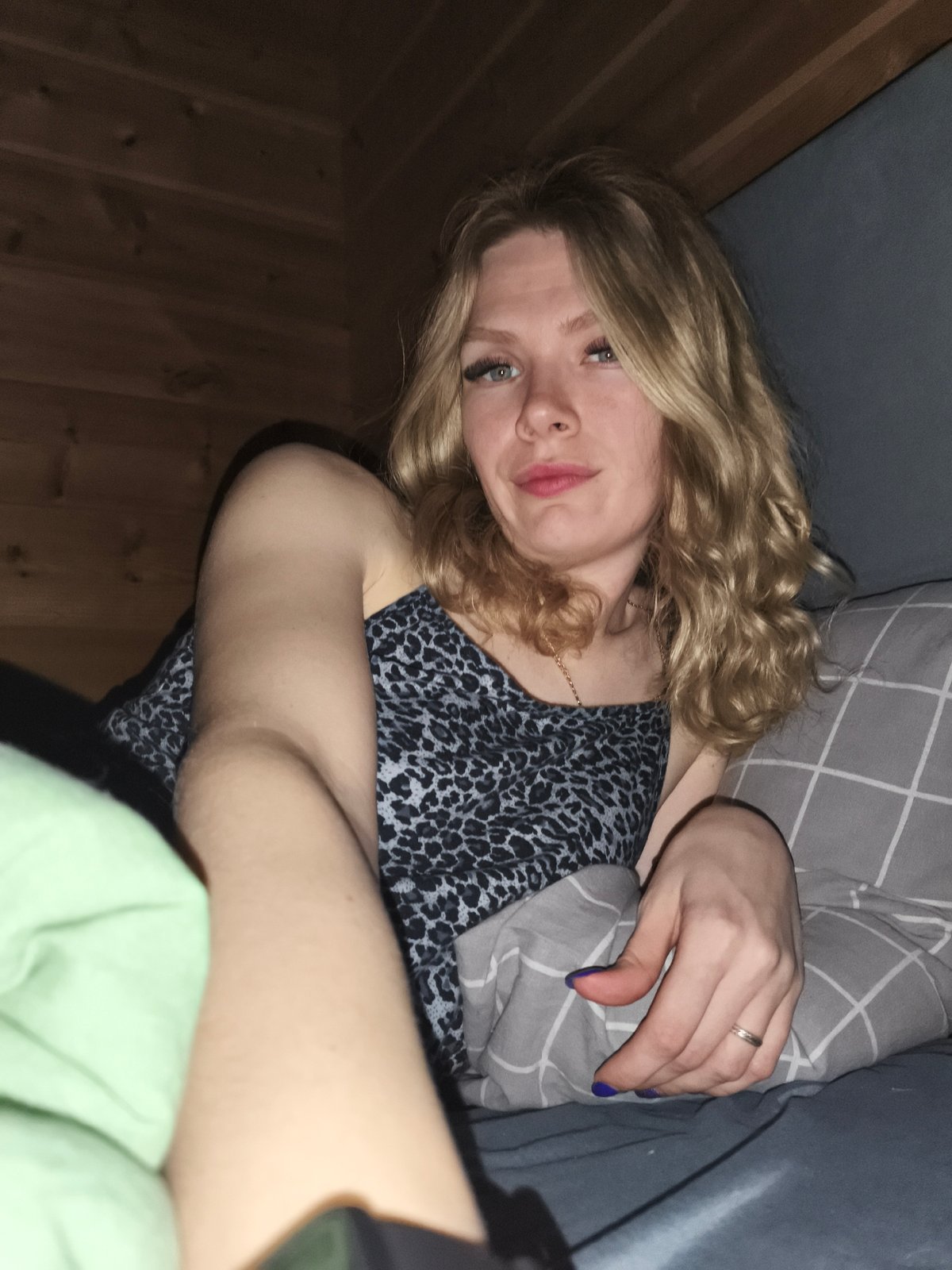Woman resting in bed observed in Русский Вожой