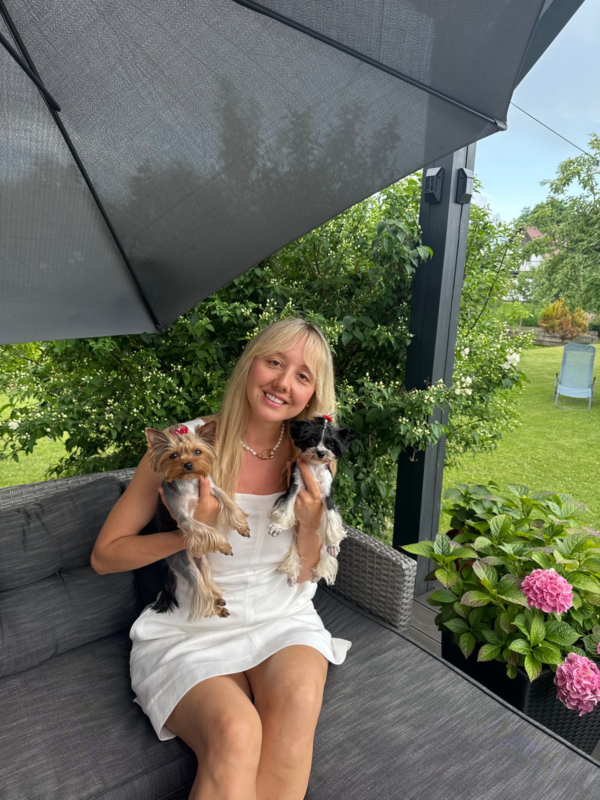 Summer backyard celebration in Carnikava with pets and food