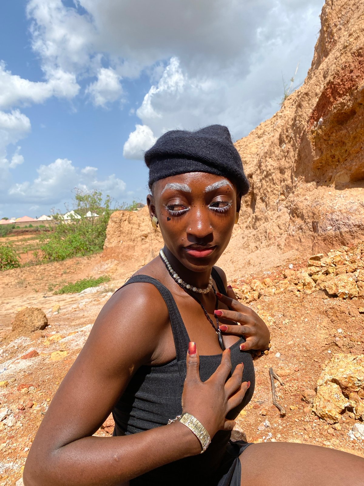 Portrait session against rocky terrain in Barakin Sabawa, Nigeria