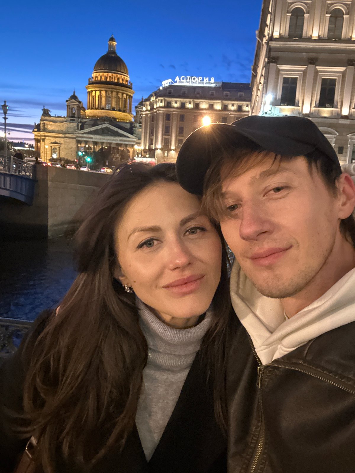 Couple takes selfie near Saint Isaac's Cathedral in Saint Petersburg