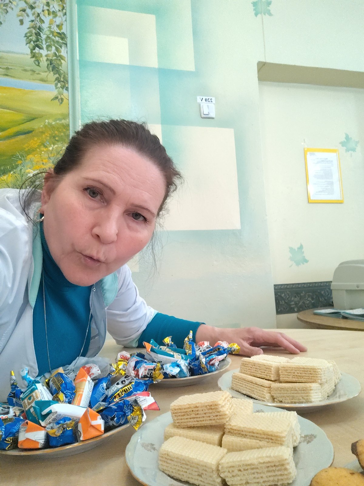 Women craft patriotic ribbon pins at Sarapul workshop