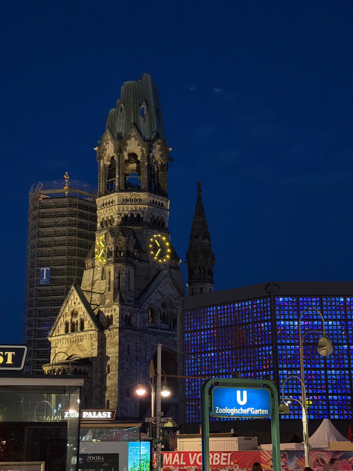 Berlin at night: memorial church ruins meet glowing modern towers