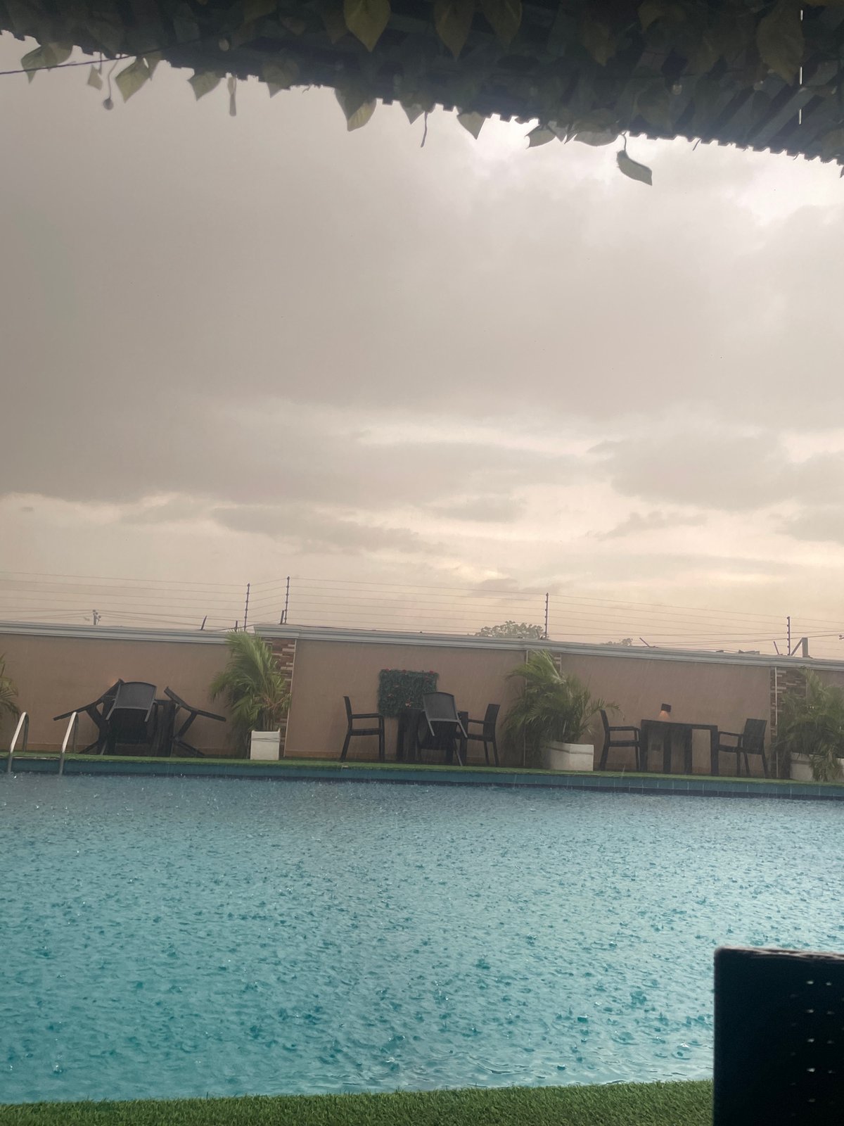 Pool party continues through heavy rainstorm in Abuja