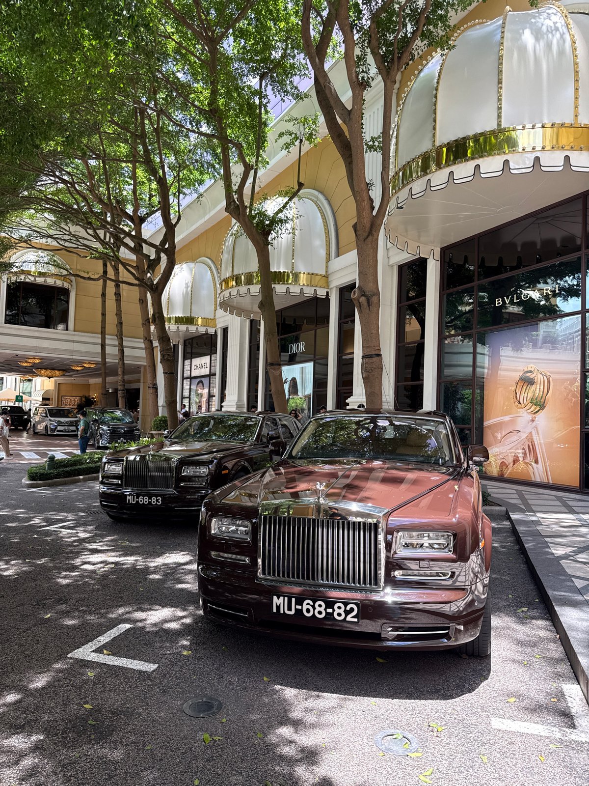 Street-level tour of Macau's Grand Lisboa strip with luxury cars