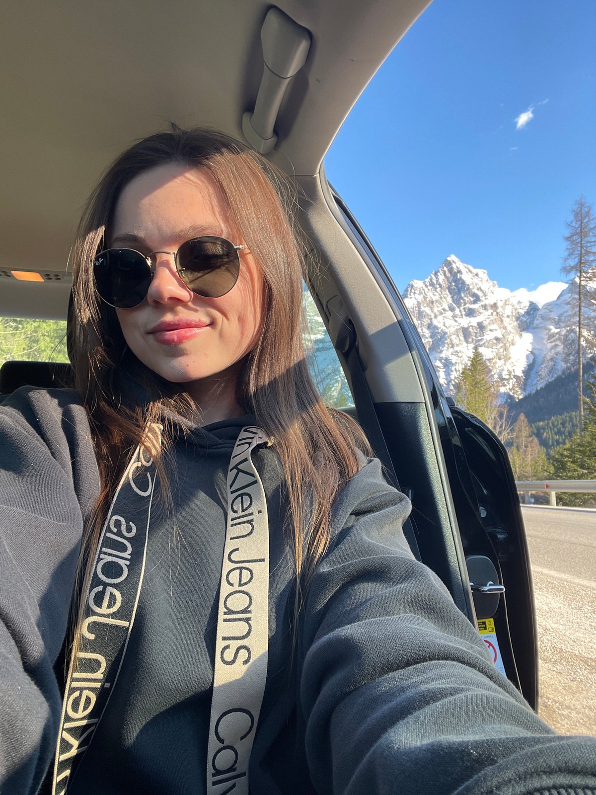 Woman documents Dolomites road trip with selfies in Italy
