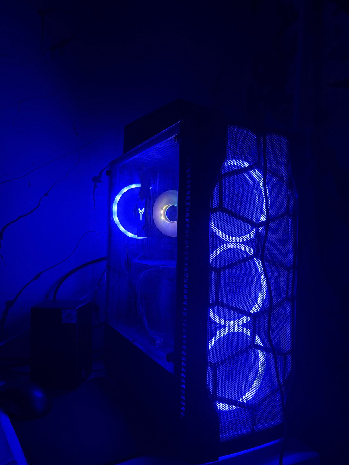 Blue-lit gaming setup and random home snapshots in Karaganda