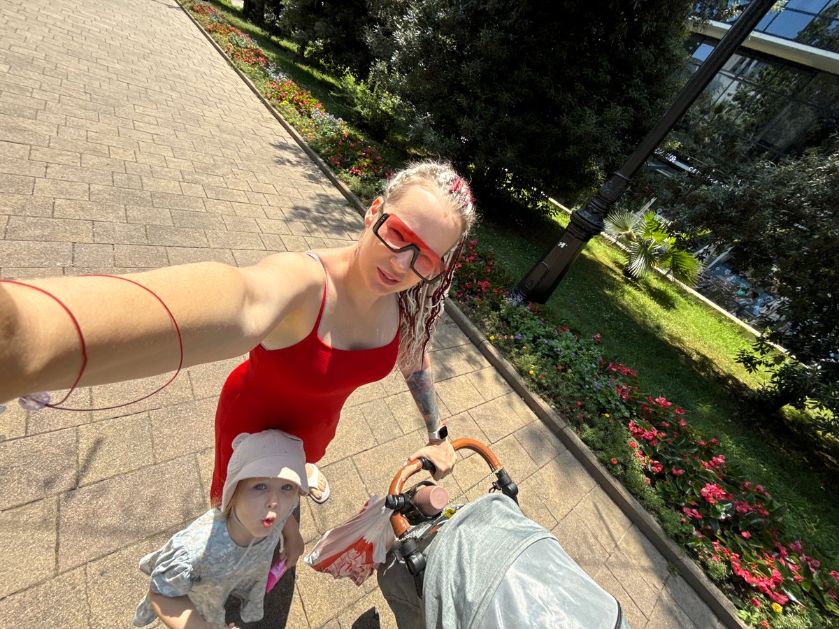 Summer morning along Sochi's promenade, roses, vintage car and café