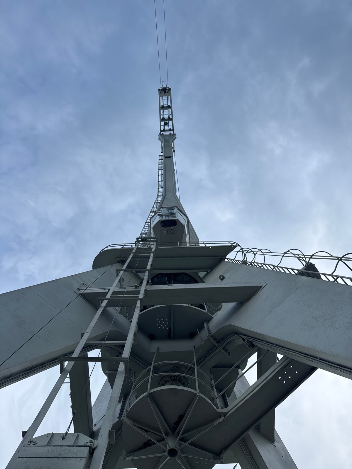 Burgas port: military vessel, gantry cranes, and calm bay views
