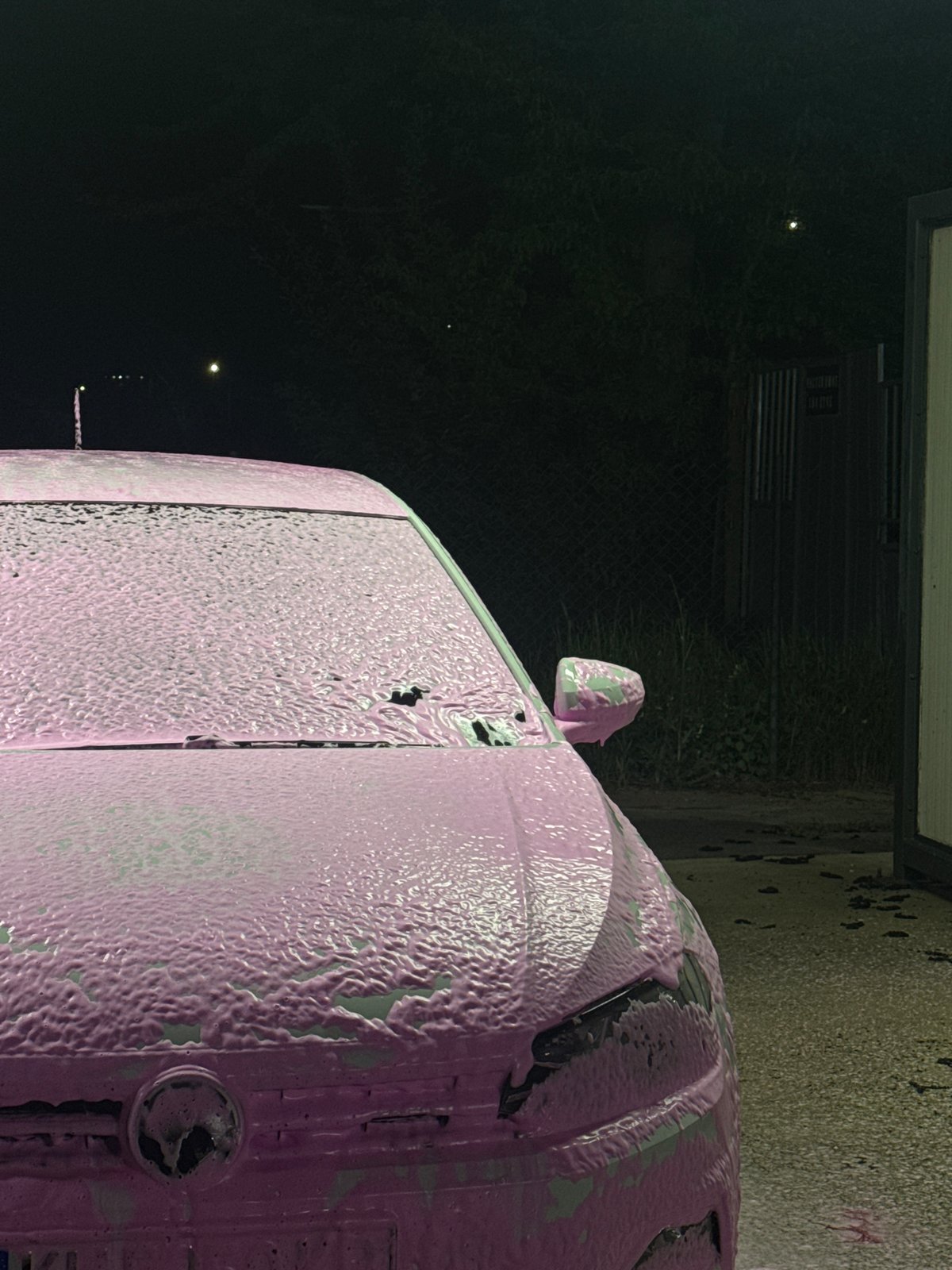 Car wash in progress at night in Dupnitsa, Bulgaria