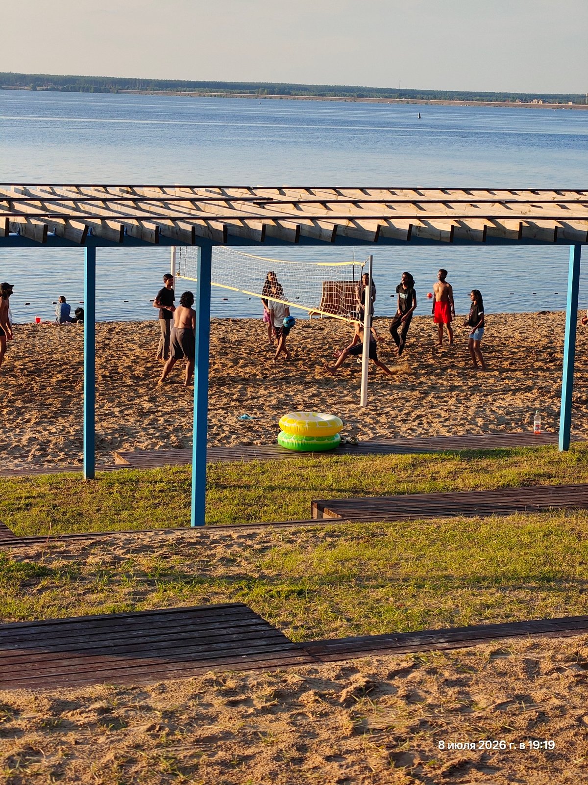 Afternoon at a waterfront promenade: walking, cycling, beach views