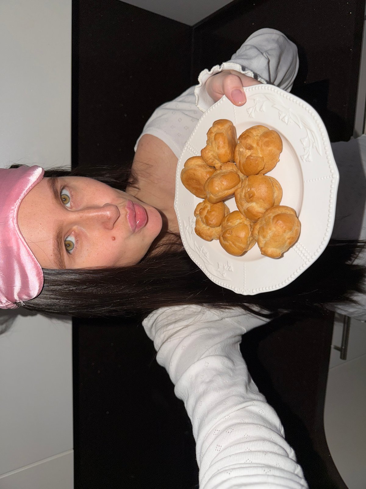 Woman poses with pastries in playful photo session, Khimki