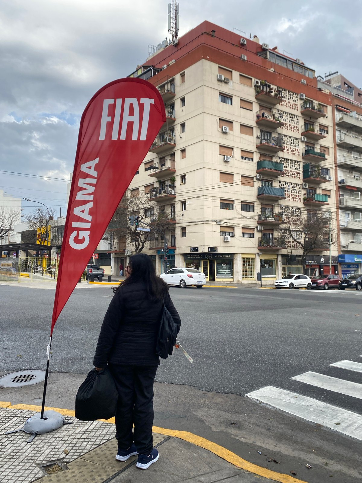 Person spotted on checkered sidewalk in Buenos Aires