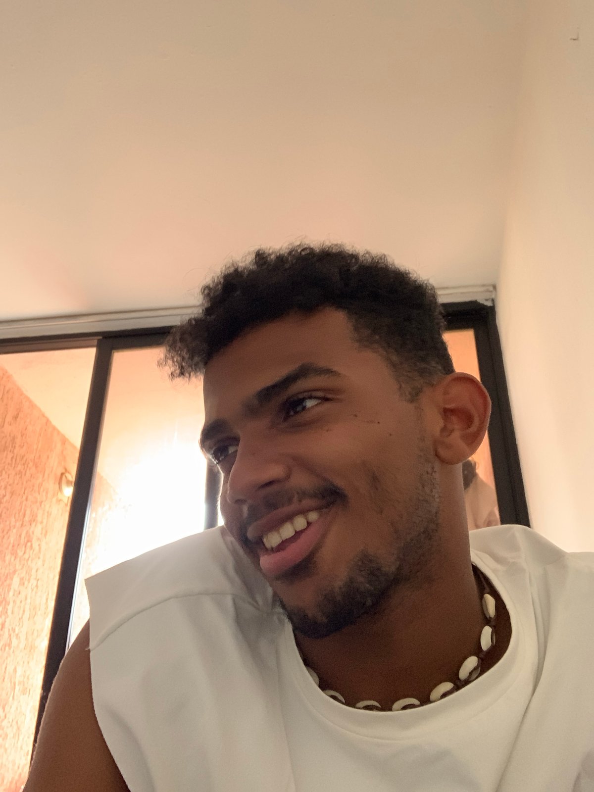 Young residents share selfies during evening in Porlamar, Venezuela