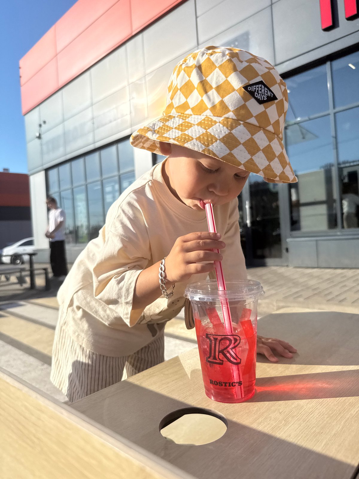 Woman takes selfie with child in Шебunino, Russia